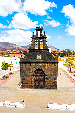 Black facade of St. Anne church built with basalt volcanic stones, Casillas del Angel, Fuerteventura, Canary Islands, Spain, Atlantic, Europe