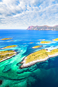 Clouds over Bergsoyan Islands rocky islets in the blue sea, Hamn I Senja, Skaland, Senja, Troms county, Norway, Scandinavia, Europe