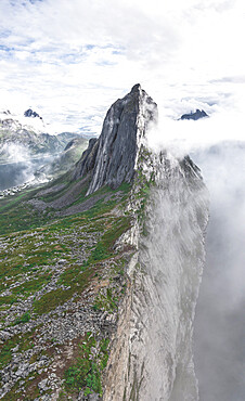 Aerial panoramic view of Mount Segla emerging from fog, Senja island, Troms county, Norway, Scandinavia, Europe