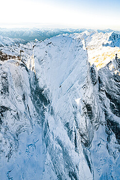 Pizzo Badile covered with snow after a winter blizzard, aerial view, Val Bregaglia, Graubunden Canton, Switzerland, Europe