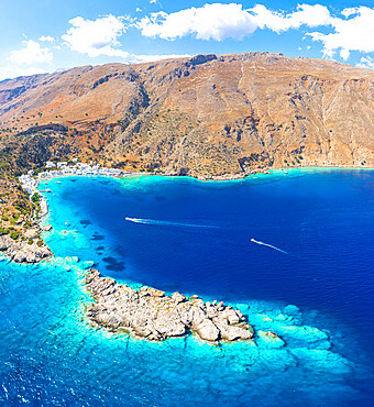 Aerial view of the village of Loutro nestled in the idyllic cove washed by turquoise sea, Crete island, Greek Islands, Greece, Europe