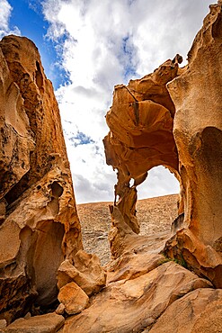 Natural stone arch eroded by wind known as Arco de las Penitas, Fuerteventura, Canary Islands, Spain, Atlantic, Europe