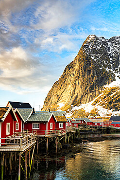 Colorful fishermen cabins framed by majestic mountains, Reine, Lofoten Islands, Nordland county, Norway, Scandinavia, Europe