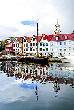 Ancient buildings and ship moored in the harbor of Torshavn, Streymoy Island, Faroe Islands, Denmark, Europe