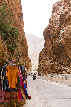 Clothes for sale hanging on rocks at the famous Todra gorges, Tinghir, Atlas mountains, Ouarzazate province, Morocco, North Africa, Africa