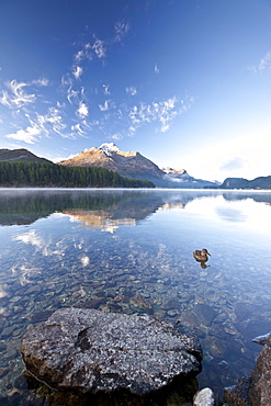 Piz da la Margna reflecting in Lake Sils by Saint Moritz in Engadine, Graubunden, Switzerland, Europe