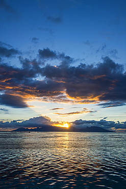 Dramatic sunset over Moorea, Papeete, Tahiti, Society Islands, French Polynesia, Pacific