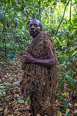 Pygmy man going nethunting, Unesco site Dzanga Sangha National Park, Central African Republic