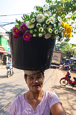 Woman selling flowers, Ye, Mon state, Myanmar (Burma), Asia