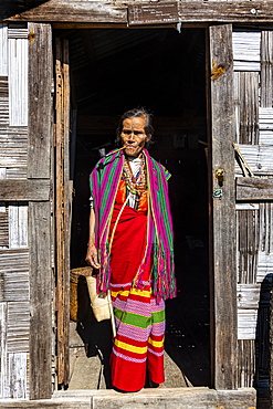 Chin woman with spiderweb tattoo smoking a pipe, Mindat, Chin state, Myanmar (Burma), Asia