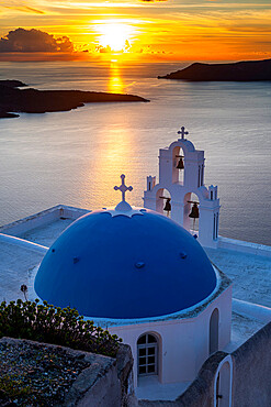 Sunset over the volcanic islands of Santorini and Anastasi Orthodox Church at sunset, Fira, Santorini, Cyclades, Greek Islands, Greece, Europe