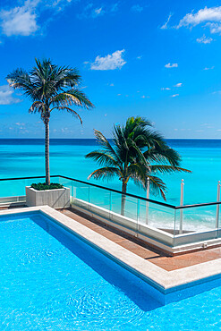 Swimming pool over the turquoise waters of Cancun, Quintana Roo, Mexico, North America