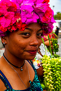 Colourful dressed woman with flowers on her head, Hikueru, Tuamotu archipelago, French Polynesia, South Pacific, Pacific