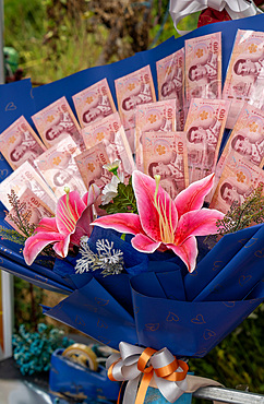 Flower bouquets, soft toys and money souvenirs for sale for graduation ceremony at Chiang Mai University, Chiang Mai, Thailand