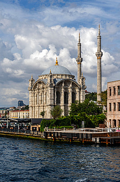 Views and passengers at ferry trip down the Bosphorus Strait with palaces,mosques and mansions from Asian and European sides, in Istanbul, Turkey, Türkiye