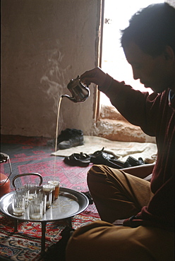 Western sahara. Man making tea in polisario smara camp.