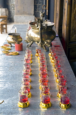 China altar with candles in a temple in a village in yunnan province