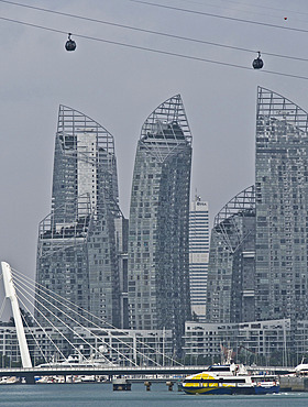 Reflections award-winning skyscrapers at Keppel Bay by Sentosa Island, with cable car in foreground, Singapore, Southeast Asia, Asia