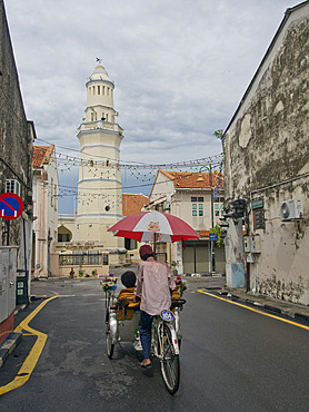 Tourists on bicycles in Penang, Malaysia, Southeast Asia, Asia