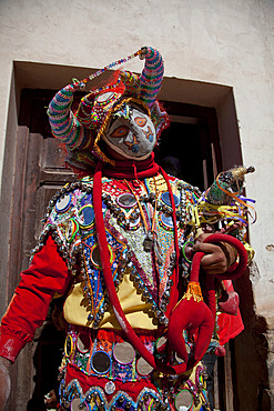 Reveller in costume and mask at Humahuaca carnival in Jujuy province in the Andes region of Argentina, South America