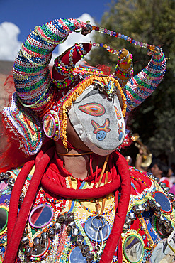 Revellers in costumes and masks at Humahuaca carnival in Jujuy province in the Andes region of Argentina, South America