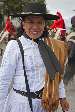 Woman in a parade of gauchos in traditional costumes in Salta, Argentina,South America