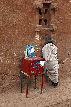 Pilgrim during the Easter Orthodox Christian religious celebrations in the ancient rock-hewn churches of Lalibela, Ethiopia, Africa