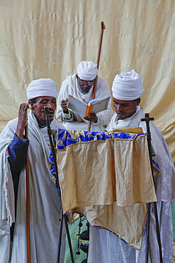 Priests singing during service at Easter Orthodox Christian religious celebrations in Lalibela, Ethiopia, Africa