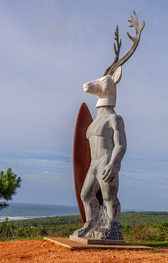 Statue to the surfer at the windy surfing north beach in Nazare ,Portugal, host to one of the World's major surf competitions with 30m waves