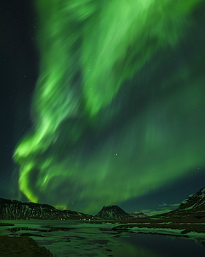 Aurora borealis (Northern Lights) and partially frozen lake, North Snaefellsnes, Iceland, Polar Regions