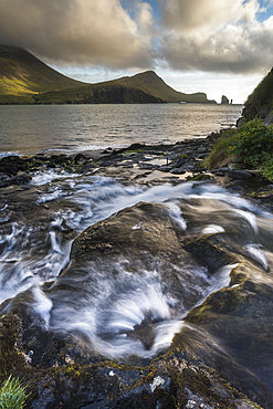 Stream leading into Sorvags Fjord, Bour, Vagar Island, Faroe Islands, Denmark, Atlantic, Europe