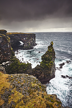 Storm surf against lava cliffs at Skalasnagi, in Snaefellsjokull National Park, the northwestern tip of the Snaefellsnes peninsula, on the west coast of Iceland, Polar Regions