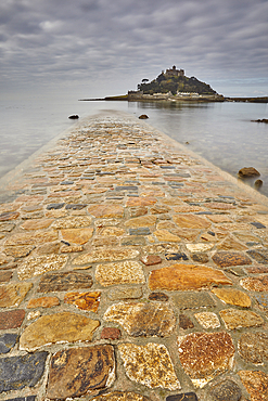 St. Michael's Mount in early morning light and a falling tide, with the causeway between the island and the mainland at Marazion still largely submerged; Marazion, near Penzance, Cornwall, England, United Kingdom, Europe