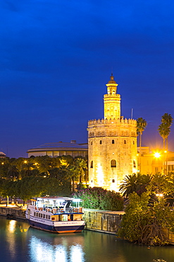 Torre del Oro (Gold Tower) and river Rio Guadalquivir at night, Seville, Andalusia, Spain, Europe