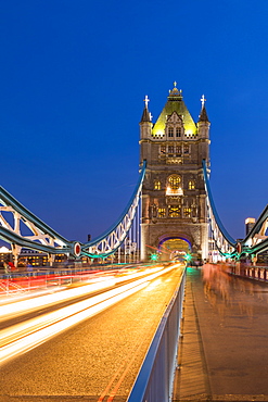 Light trails on Tower Bridge at sunset in London, England, Europe