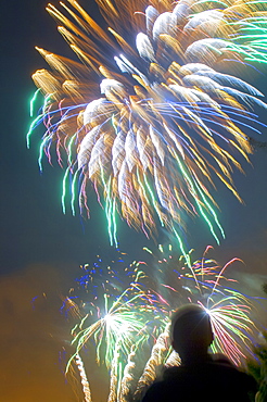 A man watching fireworks, United Kingdom, Europe