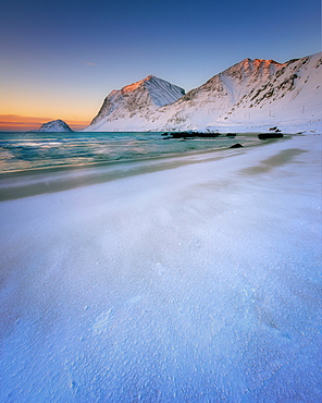 Snow covered Haukland Beach at sunset, Lofoten Islands, Nordland, Norway, Europe