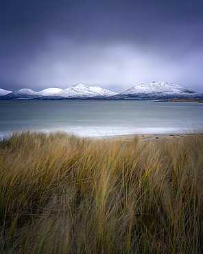 Winter at Luskentyre beach with snow capped mountains, Isle of Harris, Outer Hebrides, Scotland, United Kingdom, Europe