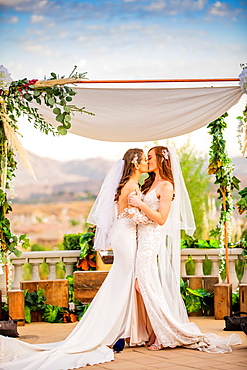 Brides sharing the pronounced kiss, Corona, California, United States of America, North America