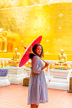 Woman at Wat Phra Singh Woramahawihan, Chiang Mai, Thailand, Southeast Asia, Asia