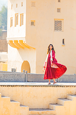 Woman in red garment at Panna Meena ka Kund, Jaipur, Rajasthan, India, Asia