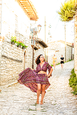 Woman posing on the street in Berat, Albania, Europe