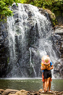 Couple in front of the waterfall in Savu Savu, Fiji, South Pacific, Pacific