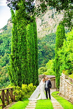 Couple, bride and groom, posing at the Castello di Rossino, Lake Como, Lombardy, Italy, Europe