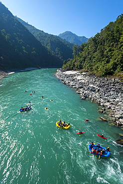 Rafts and kayaks drift down the Karnali River in west Nepal, Asia