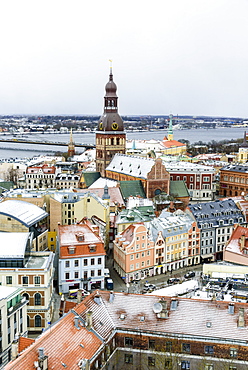 View over Riga Old Town city centre and Daugava River, with snow covered rooftops, UNESCO World Heritage Site, Riga, Latvia, Europe