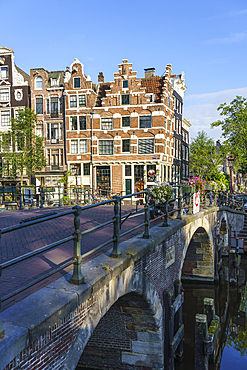 Old gabled buildings by a bridge on Prinsengracht, Amsterdam, North Holland, The Netherlands, Europe