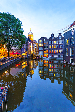 Old gabled buildings by a canal at dusk, Oudezijds Kolk, Amsterdam, North Holland, The Netherlands, Europe