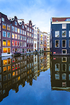 Old gabled buildings by a canal at dusk, Oudezijds Kolk, Amsterdam, North Holland, The Netherlands, Europe