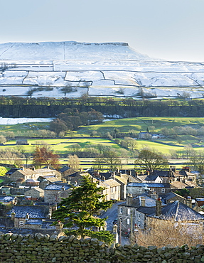 Askrigg village and snow capped Addlebrough in upper Wensleydale, The Yorkshire Dales, Yorkshire, England, United Kingdom, Europe